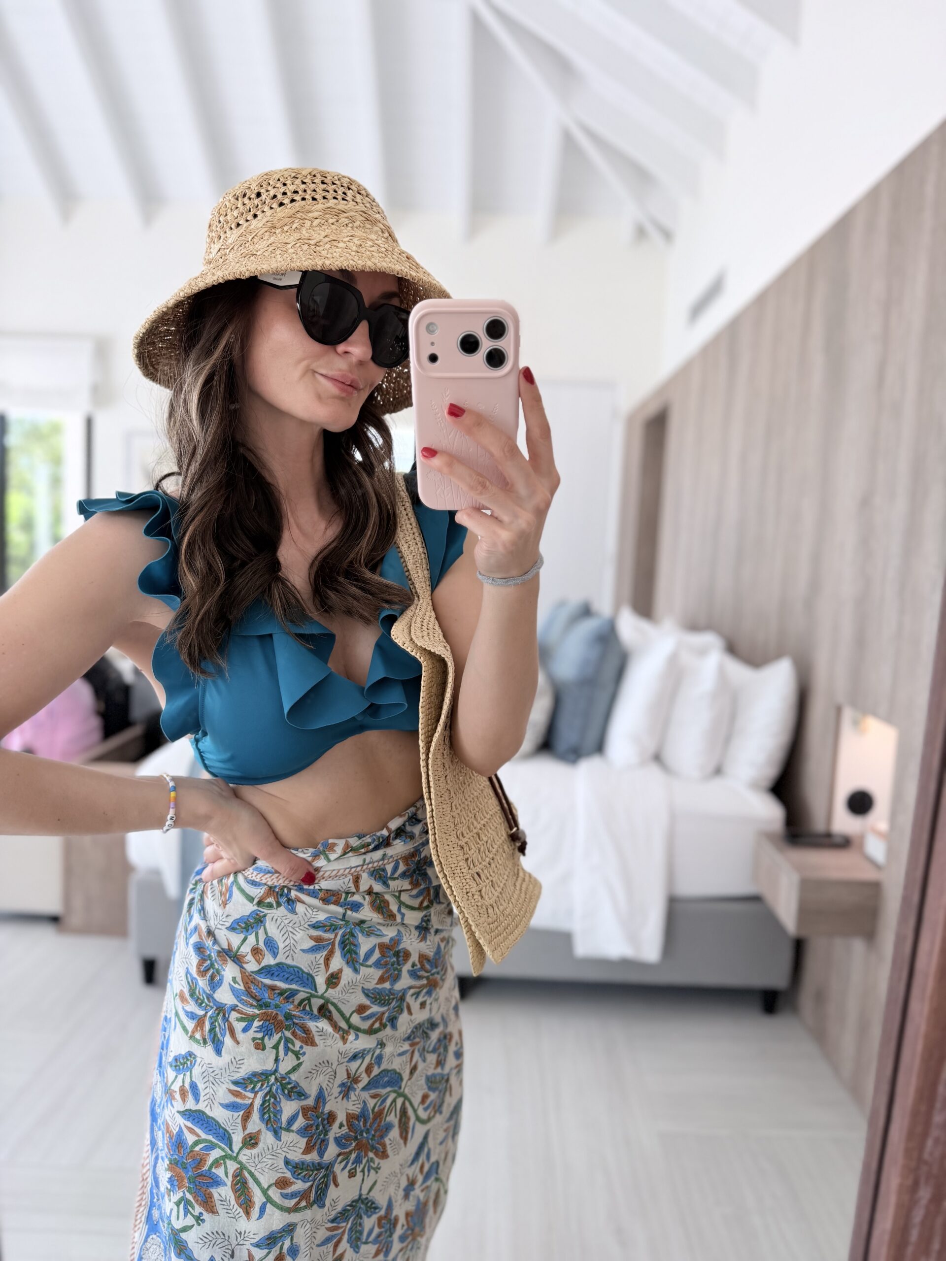 woman wearing a hat wig on vacation